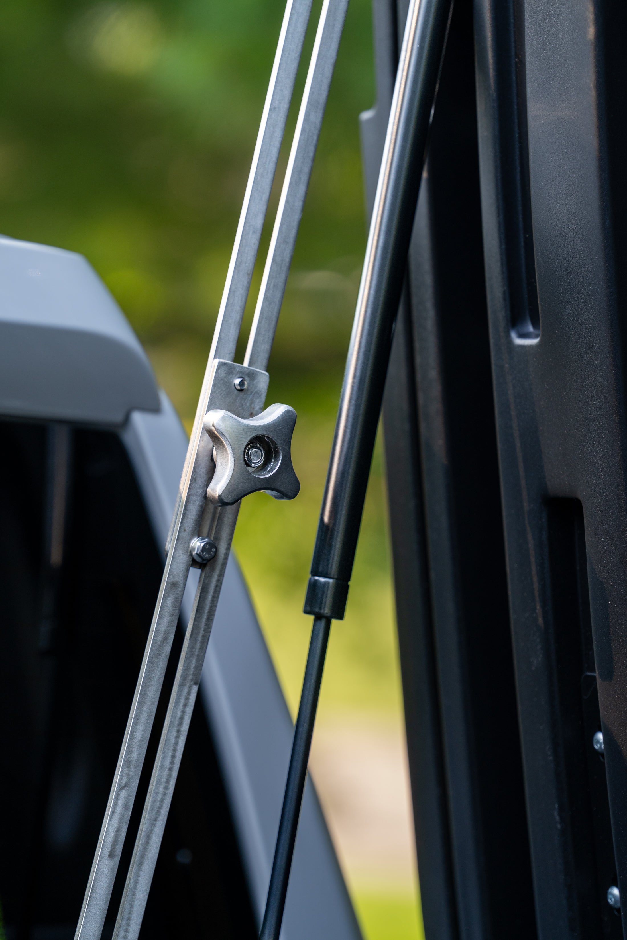 Close-up of FastBack position lock and gas strut hardware