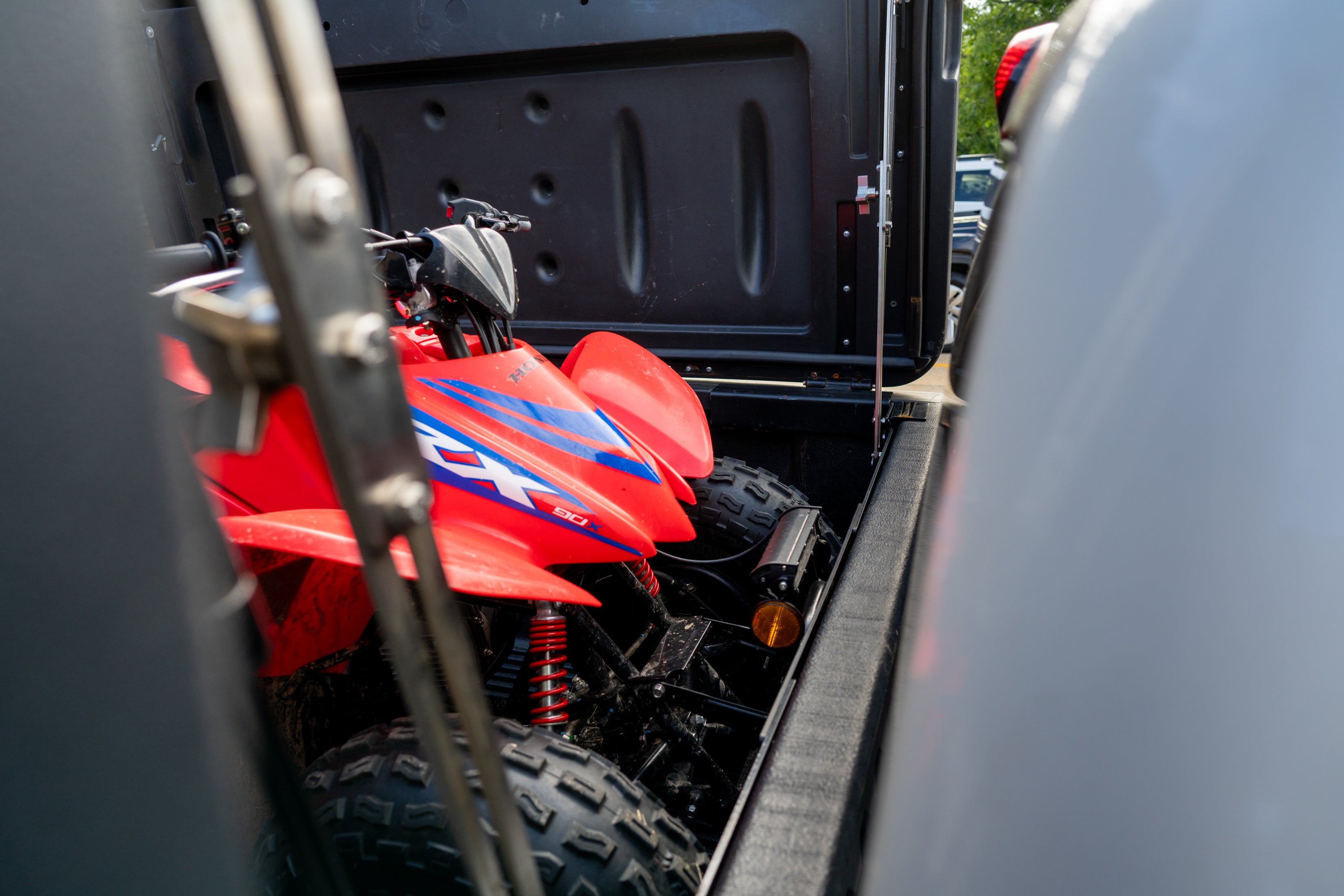 Close view of an ATV loaded under an open FastBack cover